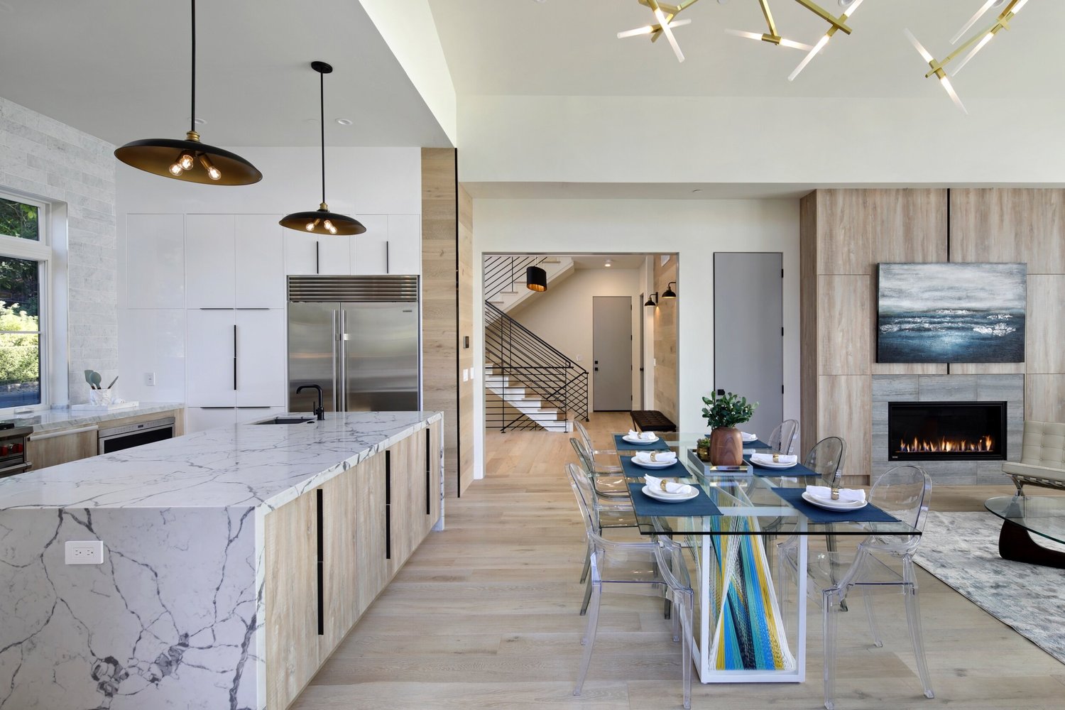 Kitchen with marble island and pendant lights